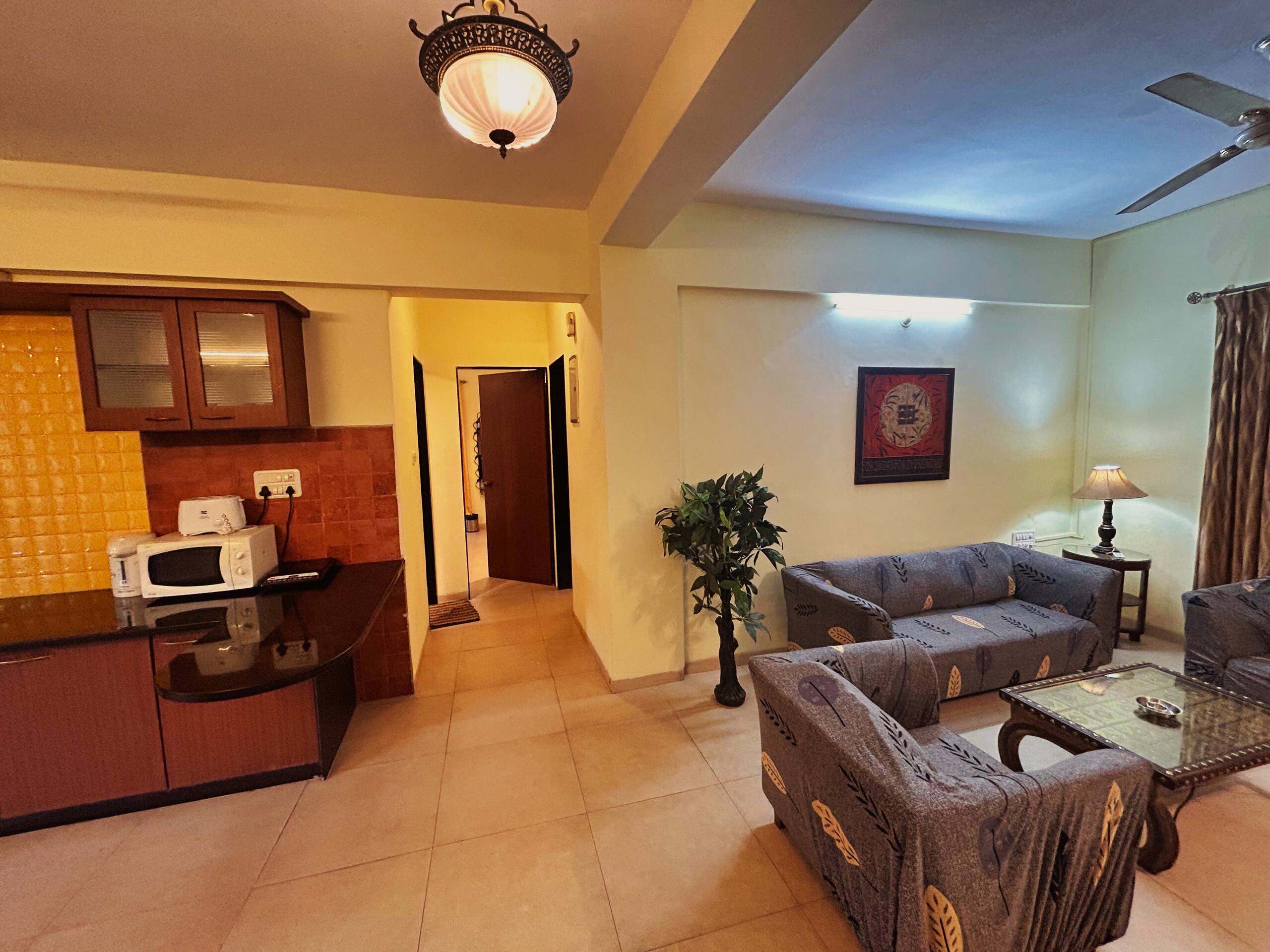 2BHK Apartment Pool facing Apt by Laze Around Us 11